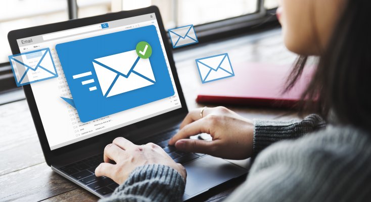 campaigner email marketing program software platform woman sending email on laptop white envelope blue background on laptop monitoir